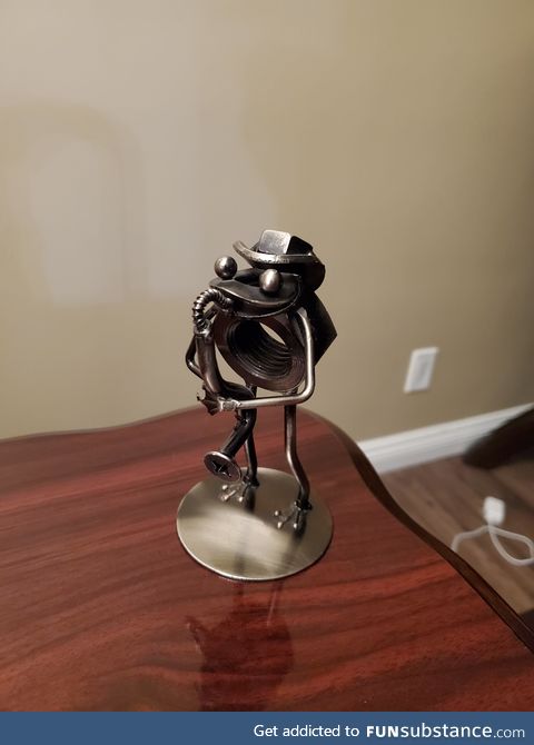 My husband's customer made him a little frog playing an instrument, using materials my