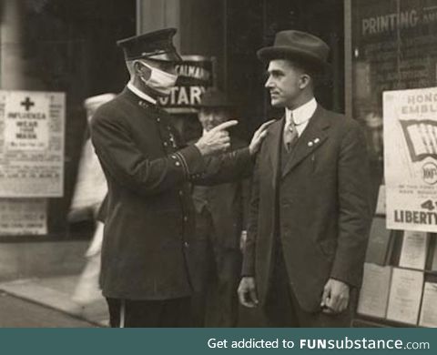 San Fransisco police officer scolding a man for not wearing a mask during the 1918