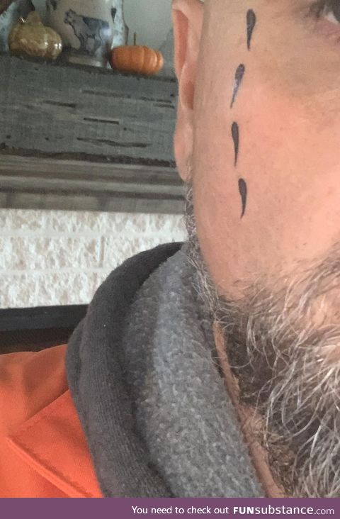 Dressing up as a convict to pass out candy. Wife put fake tear tattoos on upside down