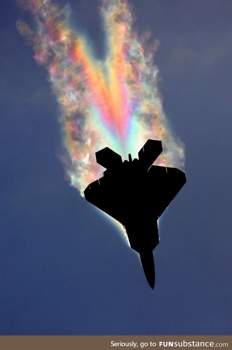 An F-22 Raptor pulling so many Gs the low pressure air over the fuselage gets cold enough