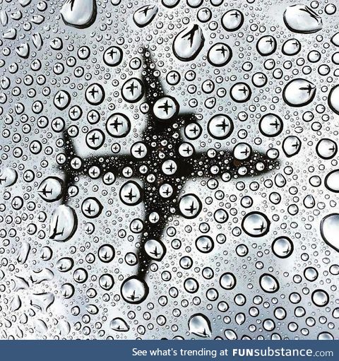 The way these water droplets reflect the plane the other way