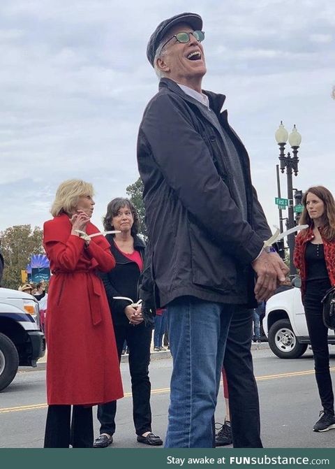 Ted Danson getting arrested during a protest