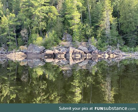 Canadian Shield rock reflection in La Mauricie National Park, Canada