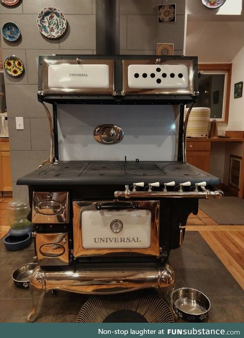 My parent's 1900's wood and gas burning transition stove, newly restored after 25+ years