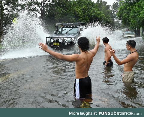 Australians celebrate in the still-rising floods