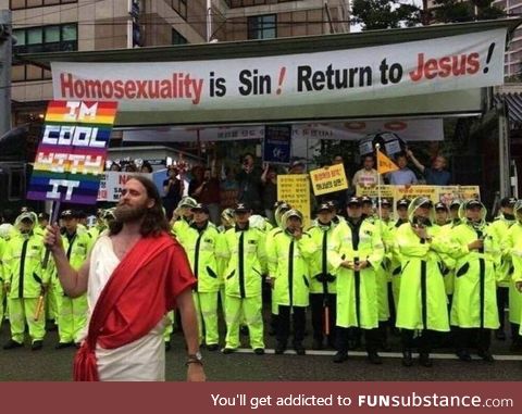 Christian protesters hung a banner at a Seoul pride parade. Robert Evans