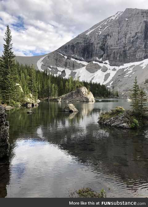 A river running by a mountain in the Canadian Rockies