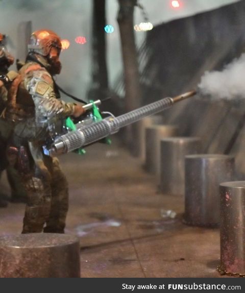 Federal Solider using pesticide sprayer to spray US, Portland protestors with unknown