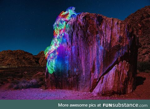 Long exposure photo that I took of myself rock climbing with LEDs tied to my body