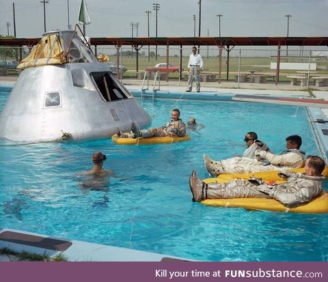 NASA actors rest after filming the final splash down scene for the moon landings