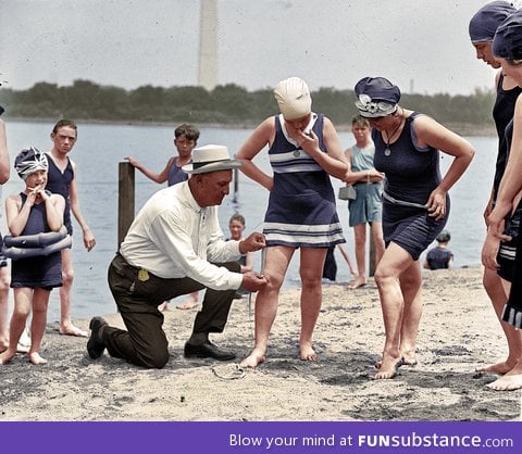 In 1922, swimsuit police would check the length of a suit (Colorized photo)