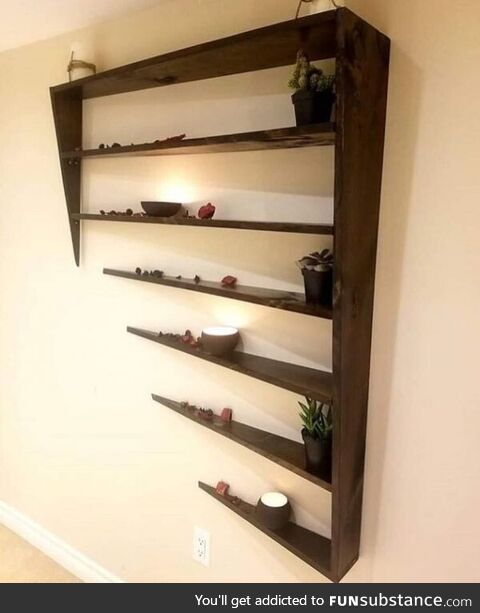 This shelf designed by Bethesda Studios looks like it is phasing into a wall