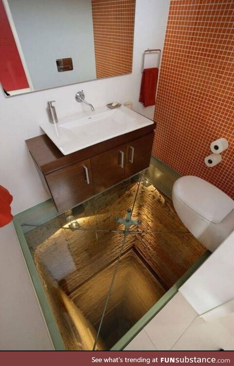 Bathroom with a glass floor on an abandoned elevator shaft
