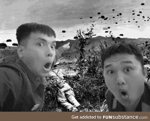 Two Viet Minh soldiers observe the french landing at Dien Bien Phu