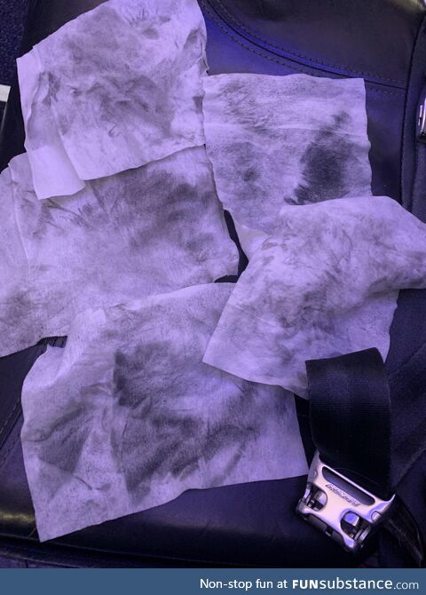 What the wipes look like after cleaning my airplane seat and headrest