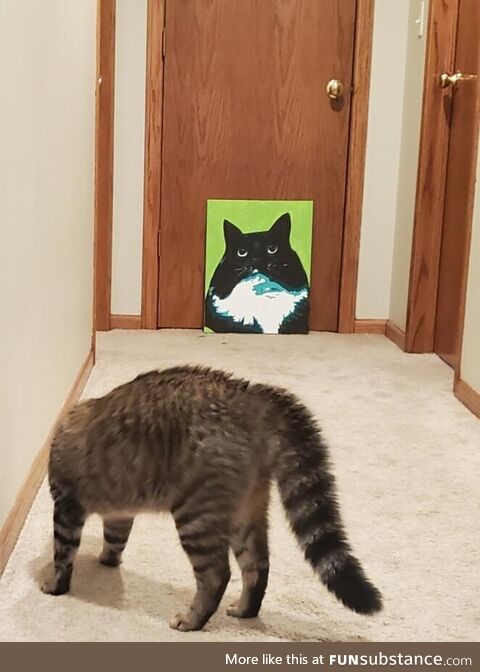 Forester scared of painting of older cat sister