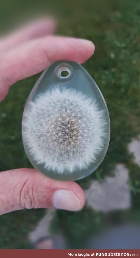 [OC] A dandelion perfectly encased in a resin pendant. Picked up a new hobby during the