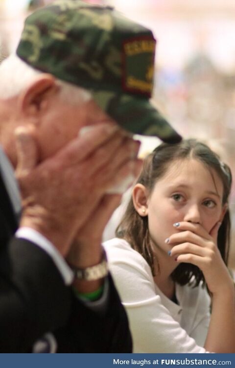 Granddaughter watching her grandfather break into tears at her school's Veterans Day