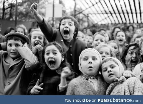 Children’s reaction to the knight slaying the dragon at a puppet show. 1963 Paris
