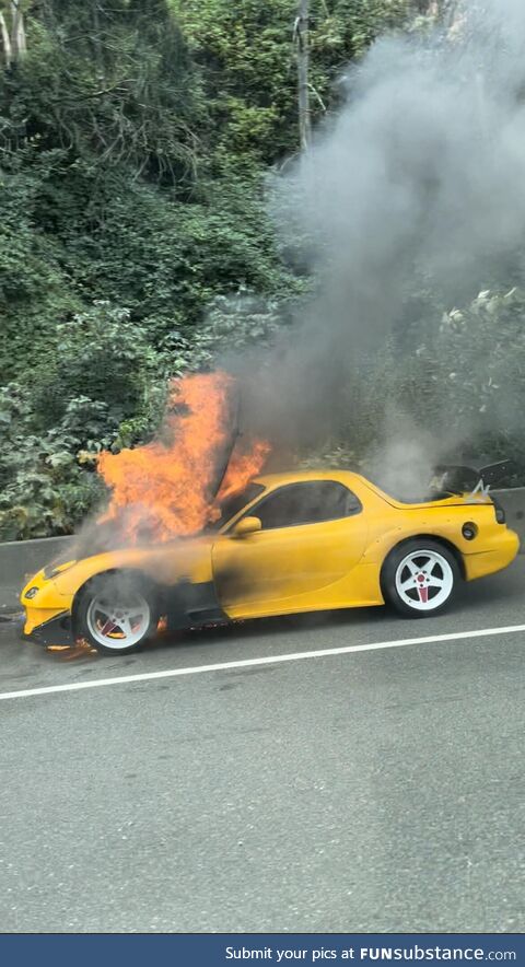 Car burning on the highway