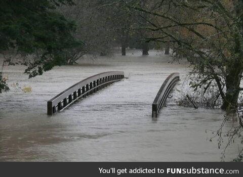 Pedestrian Footbridge Over a Creek in Langley, BC, Canada During 2021 Floods