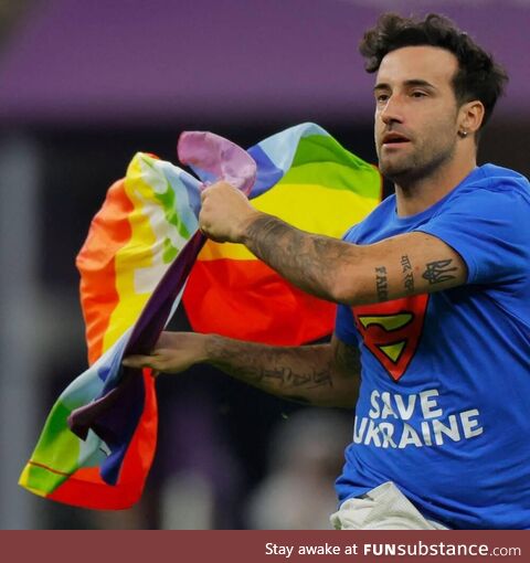 Streaker with rainbow flag during World Cup match