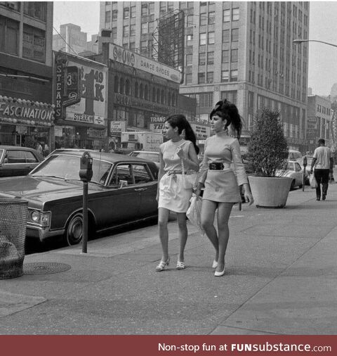 Two young women walking along Broadway between 48th and 49th Streets. New York (1969)