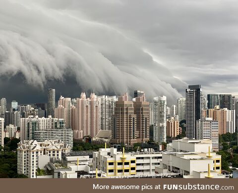 [OC] The view from the balcony of my old apartment before a storm hit Singapore, November