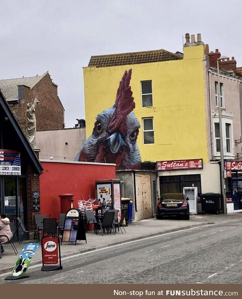 This realistic chicken art in my home town