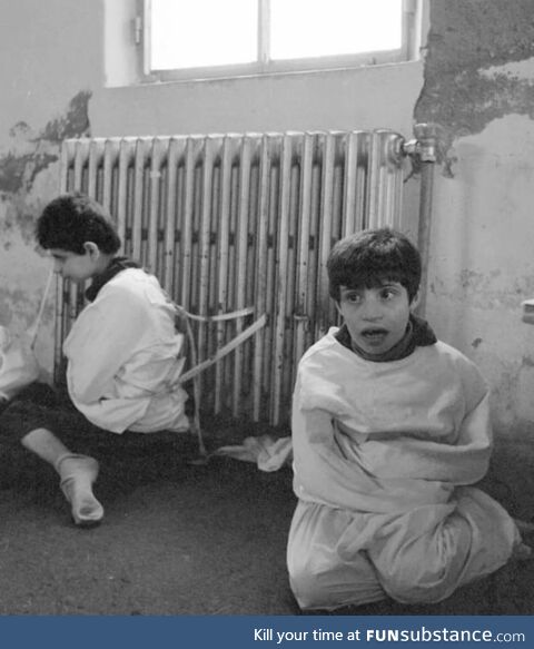 Two autistic kids tied to the radiator of a mental asylum in 1982. Yes, 1982