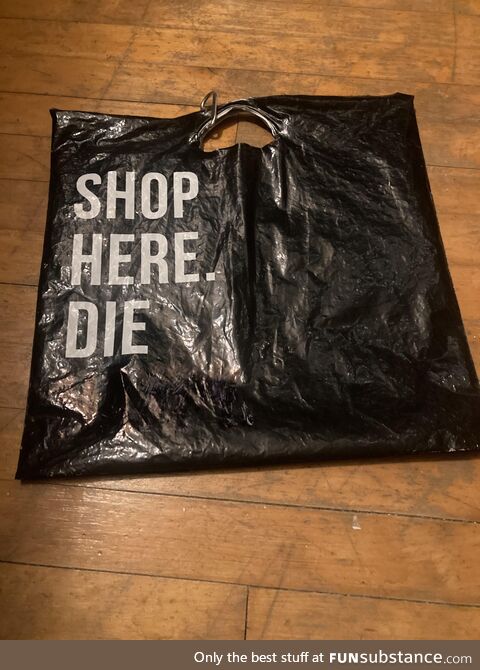 It used to say: "shop here. Die happy." but then I found a sharpie