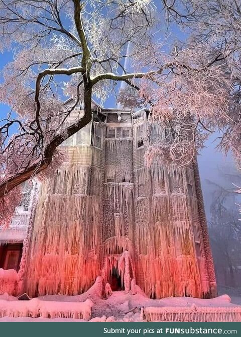 An apartment building after a large fire/firefighting in -32°C