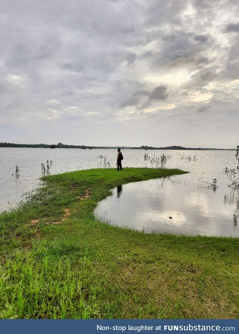 My husband at a lake early in the morning