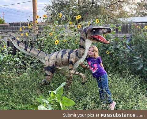 My daughter with my moms velociraptor