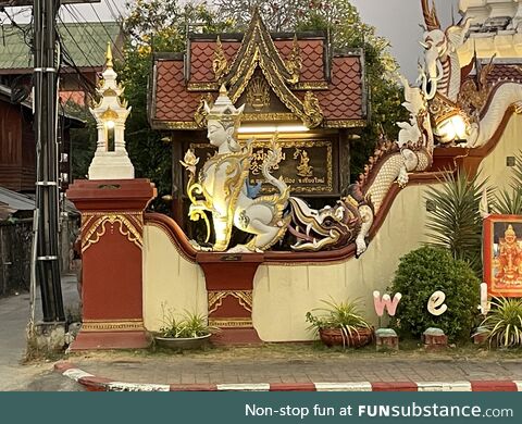 In front of a Buddhist temple in Chiangmai Mai, Thailand. Someone’s enjoying themselves!