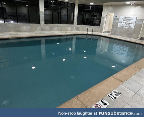 An indoor hotel pool with no people *chefs kiss