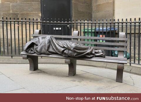 Homeless jesus statue. Nelson mandela place, glasgow, scotland