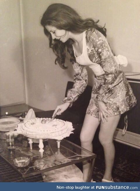 Woman cutting her birthday cake in Tehran, Iran 1973