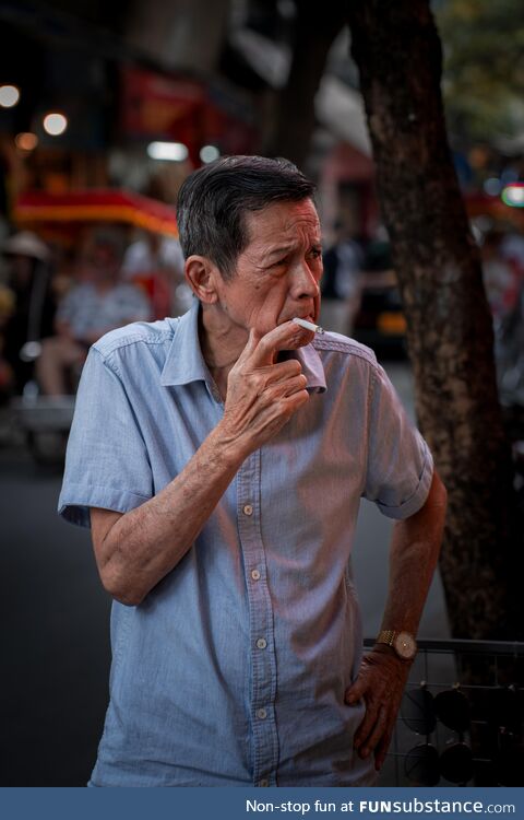 A local smoking a cigarette. Hanoi, Vietnam