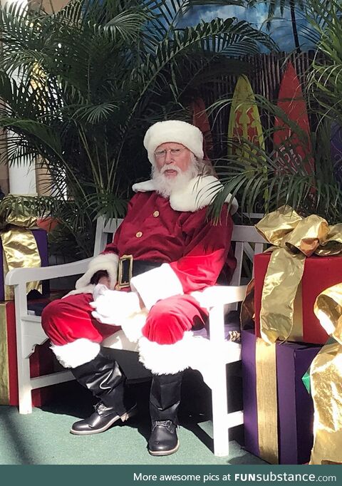 Santa looking like he's already sick of Mariah Carey, in early November, in a dead