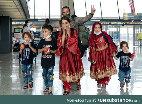 A family evacuated from Afghanistan arrives at Dulles International Airport in Chantilly,