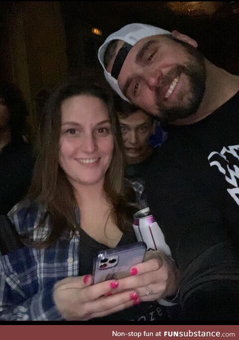 Crazy guy photobombing my girlfriend and I at a concert