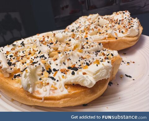 Toasted Bagel with globs of Cream Cheese, topped with Everything Bagel seasoning