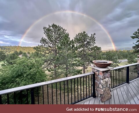 John Oliver took this photo of a half circle rainbow in Colorado