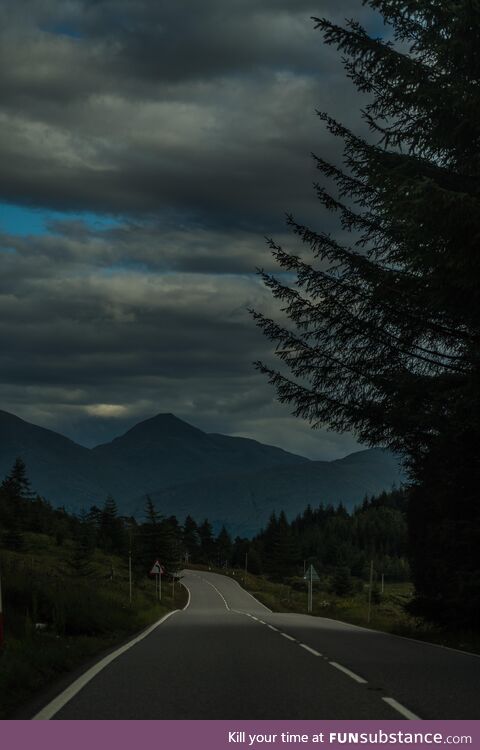 A picture of a road in Scotland, from the passenger seat @ 60mph