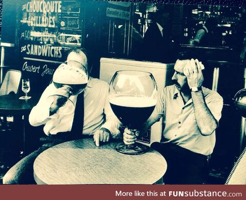 Struggle with finishing a glass of beer. Belgium, 1971