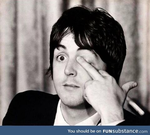 Paul McCartney giving the bird during press conferences at the Americana Hotel, May 14,