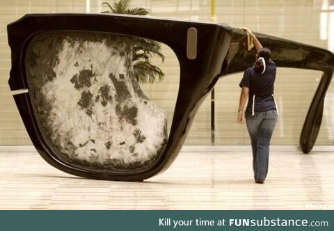 A statue of the broken glasses of Salvador Allende In the lobby of a Venezuelan ministry