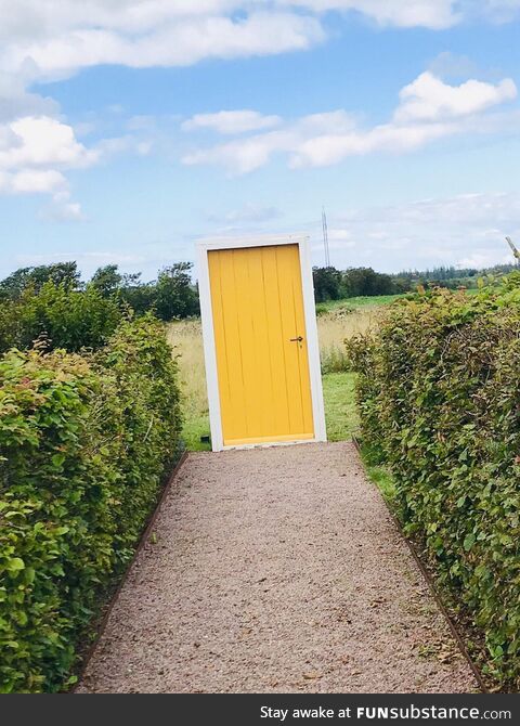 A doorway to a field