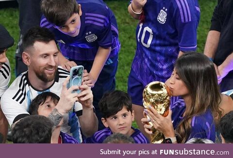 Messi taking picture of his wife